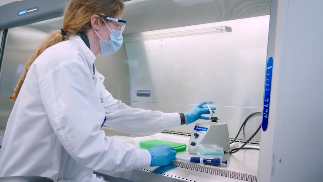 Researcher working with radiolabelled compounds