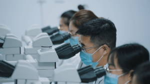 scientists using microscopes