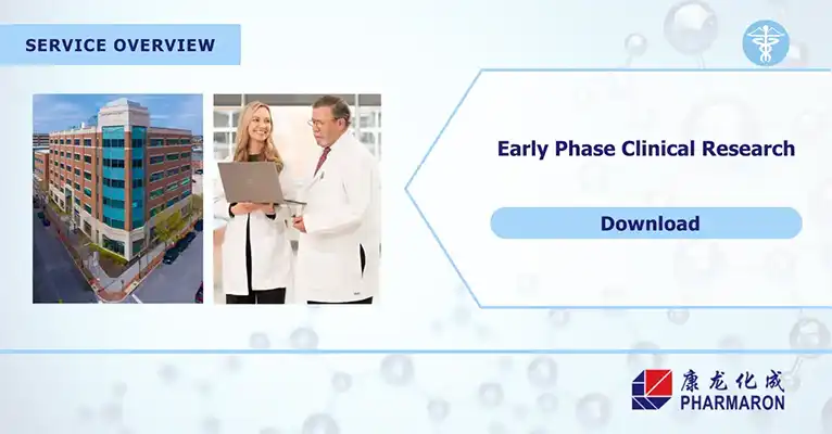 Two scientists in lab coats review data on a laptop beside a clinical research facility, promoting early phase clinical trials.