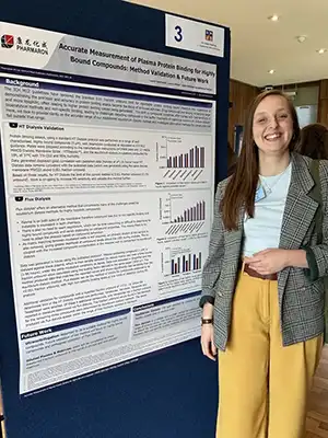 Scientist Lerrin Hilton presenting a Pharmaron research poster on plasma protein binding method validation at the DMDG Open Meeting 2025.