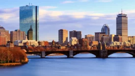 Boston skyline at dusk over the Charles River and Longfellow Bridge, promoting the PBSS Boston conference