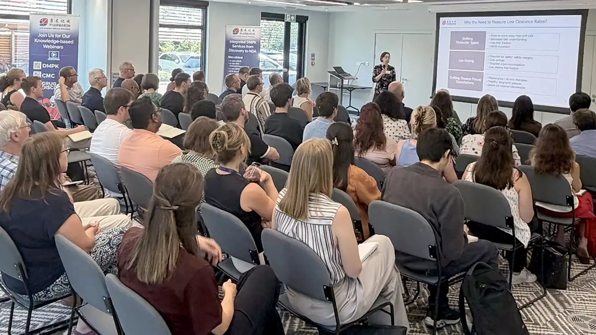 Pharmaron scientist presenting DMPK Challenges for Complex Modalities to a seated audience at the 2026 Oxford Lunch and Learn